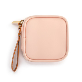 Top down view of a pink tech organizer case. The brown strap is on the case's upper right side.