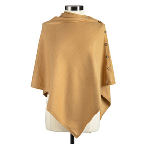 Front view of a mustard yellow wrap poncho with an irregular triangular hem. The poncho buttons at the left shoulder. The longest part of the poncho falls over the mannequin's left hip.