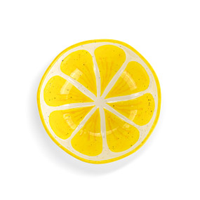 Top down view of a mini ceramic bowl, showing the lemon slice design on the interior of the bowl.