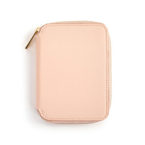 Top down view of the front of a pink passport wallet. The wallet is zipped closed, with the zipper pull on the wallet's upper left side.