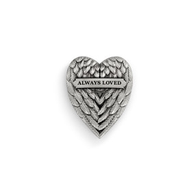 Top down view of a silver heart shaped magnet. The surface of the magnet resembles a pair of folded, feathered wings, and has the words "Always Loved" across the top.