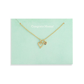 Top down view of a gold necklace with two gold heart charms attached to a light green card. "Congrats Mama" is printed at the top of the card above the necklace.