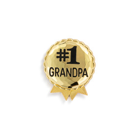 Top down view of a gold magnet shaped as an award ribbon, printed with the words "#1 Grandpa".