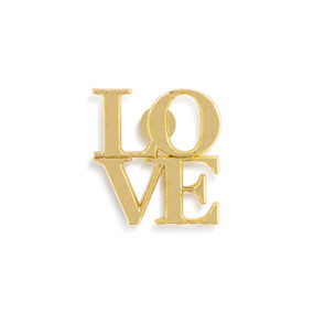 Front view of a gold magnet of the word "love". The letters L O are over the letters V E, forming a square.
