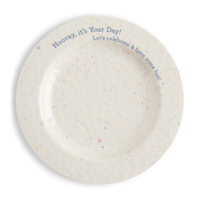 Top down view of a large melamine plate. The plate is white with multicolored dots that resemble confetti. "Hooray, it's your Day! Let's celebrate and have some fun" is printed in blue around the edge of the plate at the top.