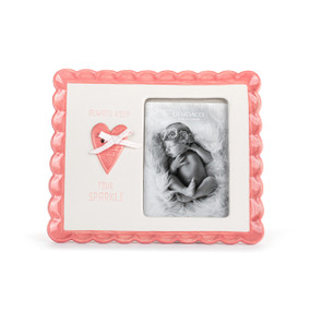 Front view an easel style fame. The edges of the frame is a pink scallop design. The frame's opening is on it's left side. On the right side of the frame is a pink heart with a white ribbon, surrounded by the phrase "always keep your sparkle".