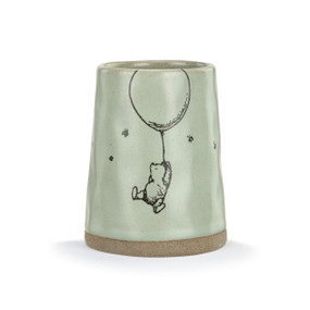 Front facing view of a light green ceramic vase with an illustration of Winnie the Pooh hanging from a balloon