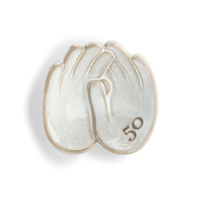 Front view of a wall art piece shaped as two hands, laced together right hand over left hand. The number 50 is printed at an angle on the right palm.