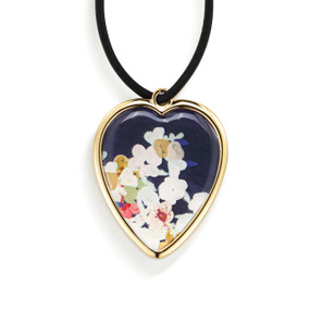 Top down view of the front of a heart shaped gift tag for a wine bottle, strung with a black cord. The heart has an image of wildflowers on a dark blue background.