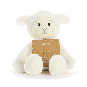 Front facing view of a white plush lamb with a card on its lap. The card holds a gold bracelet with a heart charm that has a cross cutout at its center. "Baptism" is printed on the card above the bracelet.