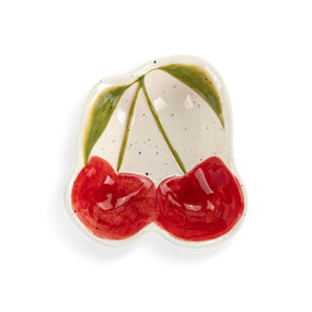 Top down view of a mini ceramic bowl shaped like two cherries on stems, showing the design on the interior of the bowl.