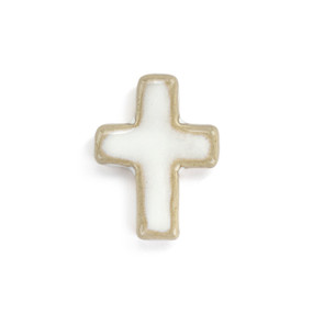Top down view of a small white cross shaped ceramic token.