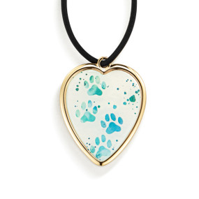 Top down view of the front of a heart shaped gift tag for a vase, strung with a black cord. The heart has an image of blue animal pawprints on a white background.