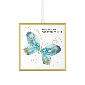 Front view of a clear glass suncatcher in a gold frame with a white cord threaded through a loop hanger on the top. On the surface of the glass is a blue butterfly. "You are my forever friend" is printed on the upper left corner.