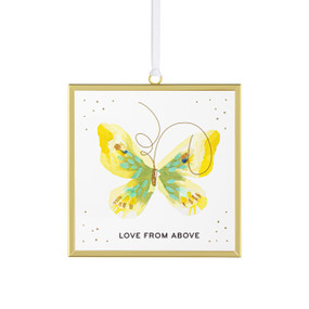 Front view of a clear glass suncatcher in a gold frame with a white cord threaded through a loop hanger on the top. On the surface of the glass is a yellow and green butterfly. "Love from above" is printed on the center bottom/