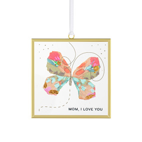 Front view of a clear glass suncatcher in a gold frame with a white cord threaded through a loop hanger on the top. On the surface of the glass is a pink and green butterfly. "Mom, I love you" is printed on the lower left corner.