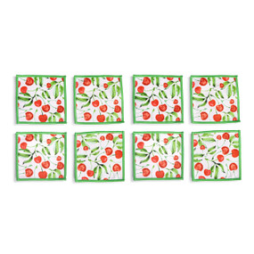 Top down view of four fabric napkins with a cherry print and green edging, The napkins are arranged in a 2x2 grid and tilted to the left.