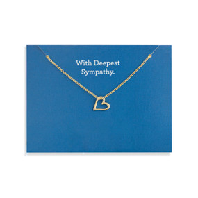 Top down view of a gold necklace with a floating heart charm attached to a dark blue card. "With deepest sympathy" is printed at the top of the card above the necklace.