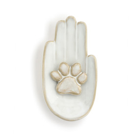 Front view of a wall art piece. The figure is a palm up right hand with an animal paw at the center of the palm.