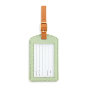 Front facing view of a sage green luggage tag, showing the opening with the ID information card. The brown strap is at the top.