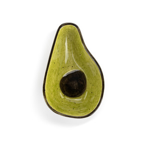 Top down view of a mini ceramic bowl shaped like an avocado, showing the halved avocado with pit on the interior of the bowl.
