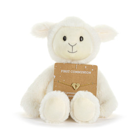 Front facing view of a white plush lamb with a card on its lap. The card holds gold bracelet with a heart charm with a cross cutout at its center. "First Communion" is printed on the card above the bracelet.