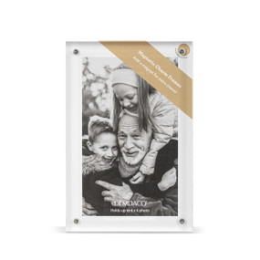 Top down view of a rectangular acrylic frame with magnets in each corner.