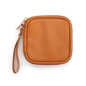 Top down view of a saddle brown tech organizer case. The brown strap is on the case's upper right side.