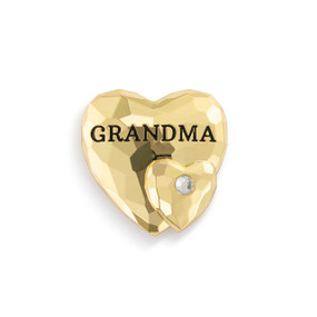 Top down view of a gold magnet featuring two hearts with the word "Grandma" across the top.