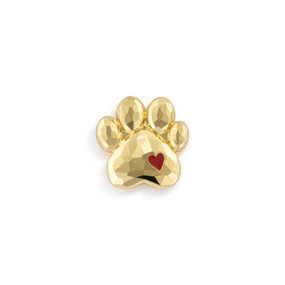 Top down view of a paw shaped magnet with a small red heart on the right side.