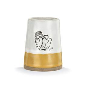 Front view of a yellow and white ceramic vase with an illustration of Winnie the Pooh laying on his back with his head stuck in a honey pot.