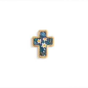Top down view of a gold cross shaped pin. The surface of the cross is a design of daffodils and other flowers against a dark blue background with gold edging.