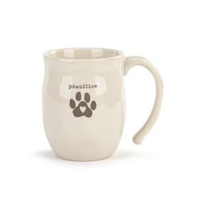 Front facing view of a white ceramic mug. The mug's handle is to the right. There is a animal paw print at the center with the word "pawsitive" in typeface above it.