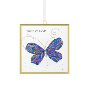 Front view of a clear glass suncatcher in a gold frame with a white cord threaded through a loop hanger on the top. On the surface of the glass is a purple and gold butterfly. "Heart of gold" is printed on the upper right corner.