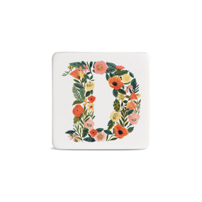 Front view of a square white magnet monogrammed with the letter D. The letter is former with a design of orange flowers and green leaves.