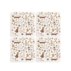 Top down view of a set of four white coasters arranged in a two by two grid featuring several small illustrations of different breeds of dogs.