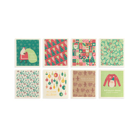 Eight different biodegradable dish cloths with different holiday illustrations on them in green and red.