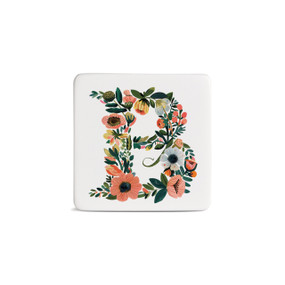 Front view of a square white magnet monogrammed with the letter B. The letter is former with a design of orange flowers and green leaves.