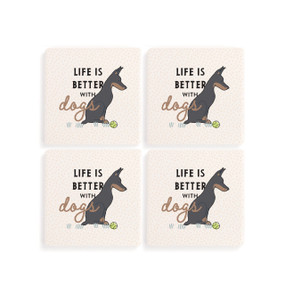 Top down view of a set of four white coasters arranged in a two by two grid featuring an illustration of a Dobermann dog to the right and "Life is better with dogs" printed to the left.