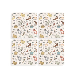 Top down view of a set of four white coasters arranged in a two by two grid featuring several small illustrations of different breeds of cats.