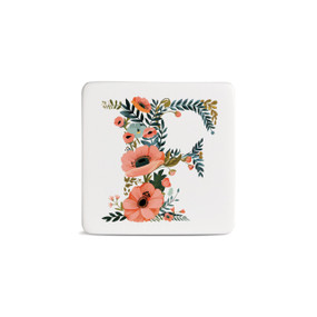 Front view of a square white magnet monogrammed with the letter F. The letter is former with a design of orange flowers and green leaves.