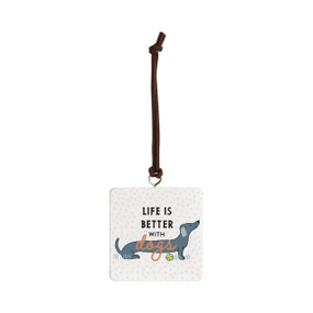 Front view of a white square ornament strung with a black cord for hanging. An illustration of a Dachshund dog is at the center, with "Life is better with dogs" printed over the dog.