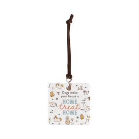 Front view of a square white ornament strung with a black cord for hanging. "Dogs make your house a home treat home" is printed at the center against a background of small illustrations of different breeds of cats and dogs.