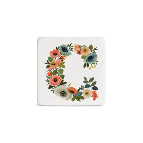 Front view of a square white magnet monogrammed with the letter C. The letter is former with a design of orange flowers and green leaves.
