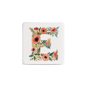 Front view of a square white magnet monogrammed with the letter E. The letter is former with a design of orange flowers and green leaves.