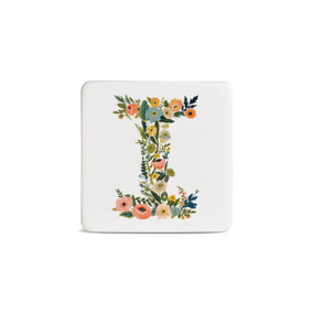 Front view of a square white magnet monogrammed with the letter I. The letter is former with a design of orange flowers and green leaves.