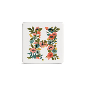 Front view of a square white magnet monogrammed with the letter H. The letter is former with a design of orange flowers and green leaves.