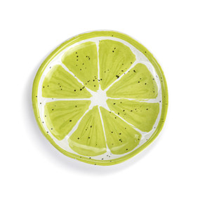 Top down view of a small plate with an image of a cut lime on the surface.