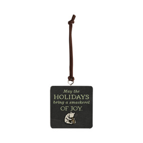 Front facing view of a black square hanging ornament with an illustration of classic Winnie-the-Pooh in the center at the bottom. Pooh has his head in a hunny pot. "May the holidays bring a smackerel of joy" is printed in light green above the illustration.