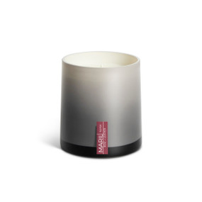 A Rose + Leather poured tester candle in an ombre gray glass vessel.